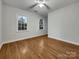 Spacious bedroom with hardwood floors and windows at 7021 Acre Hill Ct, Charlotte, NC 28277