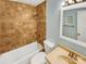 Bathroom with beige tile, a shower/tub combo, and a vanity with a mirror at 8003 Regent Park Ln, Charlotte, NC 28210