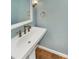 Updated bathroom with pedestal sink and elegant fixtures at 8003 Regent Park Ln, Charlotte, NC 28210