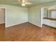 Spacious bedroom with hardwood floors and ceiling fan at 8003 Regent Park Ln, Charlotte, NC 28210