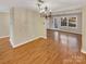 Bright dining room features hardwood floors and access to the living room at 8003 Regent Park Ln, Charlotte, NC 28210