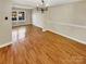 Spacious dining room with hardwood floors and a chandelier at 8003 Regent Park Ln, Charlotte, NC 28210