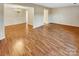 Hardwood floor living room with an open floor plan at 8003 Regent Park Ln, Charlotte, NC 28210