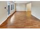 Living room with hardwood floors and sliding glass doors at 8003 Regent Park Ln, Charlotte, NC 28210