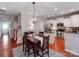 Modern kitchen with white cabinets, granite counters, and stainless steel appliances at 8244 Viewpoint Ln, Cornelius, NC 28031