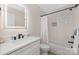 Modern bathroom with soaking tub, white vanity, and frameless shower at 8260 Blades Trl, Denver, NC 28037