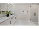 Spa-like bathroom with double vanity, frameless shower, and modern fixtures at 8260 Blades Trl, Denver, NC 28037