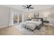 Spacious bedroom with light flooring and access to a balcony at 8260 Blades Trl, Denver, NC 28037