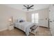 Cozy bedroom with ceiling fan and white dresser at 8260 Blades Trl, Denver, NC 28037