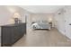 Bright bedroom with dresser, queen bed and neutral color palette at 8260 Blades Trl, Denver, NC 28037