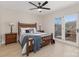 Bedroom with wooden bed frame and access to a deck at 8260 Blades Trl, Denver, NC 28037