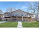 Brick home with large deck and walkway, offering lake views at 8260 Blades Trl, Denver, NC 28037