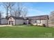 Brick ranch home with attached garage and landscaped yard at 8260 Blades Trl, Denver, NC 28037
