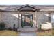 Inviting front entrance with brick columns and a dark wooden door at 8260 Blades Trl, Denver, NC 28037