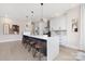 Modern kitchen with white cabinets, quartz countertops, and a large island at 8260 Blades Trl, Denver, NC 28037
