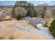 Aerial view of a ranch house with a circular driveway, pool, and detached garage at 9330 Bellhaven Blvd, Charlotte, NC 28214