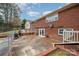 Brick patio with basketball court and fenced backyard at 9330 Bellhaven Blvd, Charlotte, NC 28214