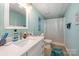 Basement bathroom with shower and modern vanity at 9330 Bellhaven Blvd, Charlotte, NC 28214
