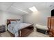 Cozy basement bedroom with a double bed and wood dresser at 9330 Bellhaven Blvd, Charlotte, NC 28214