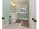 Light and airy bathroom with double vanity and a window at 9330 Bellhaven Blvd, Charlotte, NC 28214