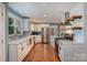 Renovated kitchen boasts white cabinets, quartz countertops, and stainless steel appliances at 9330 Bellhaven Blvd, Charlotte, NC 28214