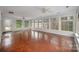 Sunroom with terracotta tile floor and many windows at 9330 Bellhaven Blvd, Charlotte, NC 28214