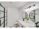 Bathroom with double vanity, large mirrors, and a walk-in shower at 111 Oakmont Rd, Stanley, NC 28164