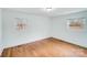 Bright bedroom with hardwood floors and two windows at 111 Oakmont Rd, Stanley, NC 28164