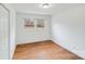 Bright bedroom with hardwood floors and two windows at 111 Oakmont Rd, Stanley, NC 28164