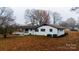 House exterior showcasing white brick and landscaping at 111 Oakmont Rd, Stanley, NC 28164