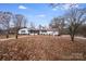White brick ranch house with walkway and landscaping at 111 Oakmont Rd, Stanley, NC 28164