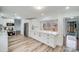 Bright kitchen features white shaker cabinets, quartz countertops, and stainless steel appliances at 111 Oakmont Rd, Stanley, NC 28164
