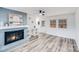 Living room with fireplace, built-in shelving, and hardwood floors at 111 Oakmont Rd, Stanley, NC 28164