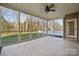 Spacious screened porch with ceiling fan and backyard view at 112 Daniel Efird Dr, Mount Holly, NC 28120