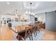 Open concept dining area with farmhouse table and view of the kitchen at 114 38Th Nw Ave, Hickory, NC 28601