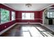 Bright dining room with hardwood floors and burgundy walls at 120 Pinewood Ln, Rock Hill, SC 29730