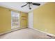 Bedroom with natural light from the window and a ceiling fan at 127 Mystic Ct, Troutman, NC 28166