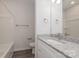 Clean bathroom with white vanity, granite countertop, and a bathtub at 13331 Central Ave, Huntersville, NC 28078