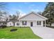 Newly constructed home with gray siding, white trim, and a spacious driveway at 13331 Central Ave, Huntersville, NC 28078