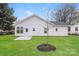White house exterior with a small patio and yard at 13331 Central Ave, Huntersville, NC 28078