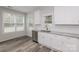Modern kitchen with white cabinets, granite countertops, and stainless steel appliances at 13331 Central Ave, Huntersville, NC 28078