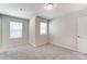 Well-lit bedroom featuring neutral walls and carpet at 14926 Tamarack Dr, Charlotte, NC 28278