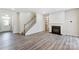 Living room with hardwood flooring and fireplace at 14926 Tamarack Dr, Charlotte, NC 28278