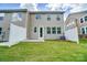 Private backyard with patio and grassy area at 14930 Tamarack Dr, Charlotte, NC 28278