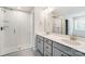 Double vanity bathroom with a large shower and modern fixtures at 14930 Tamarack Dr, Charlotte, NC 28278
