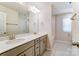 Modern bathroom with double vanity, mirror, and bathtub at 14930 Tamarack Dr, Charlotte, NC 28278