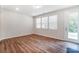 Bright Gathering room featuring hardwood floors and access to backyard at 14930 Tamarack Dr, Charlotte, NC 28278