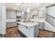 Modern kitchen with gray cabinets, quartz countertops and island at 14930 Tamarack Dr, Charlotte, NC 28278