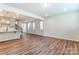 Open concept kitchen and dining area with hardwood floors and modern finishes at 14930 Tamarack Dr, Charlotte, NC 28278