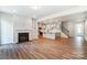 Open living room with hardwood floors and kitchen views at 14930 Tamarack Dr, Charlotte, NC 28278